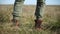 Close-up low angle Unrecognizable man in stylish vintage shoes walks into the frame stands and goes. Travel concept