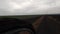 CLOSE UP, LOW ANGLE, WIDE ANGLE: Touring Bike in Cloudy Day on the Gravel Road, Cycling by the Dirty road