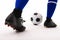 Close-up low section of biracial female soccer player playing soccer on white background