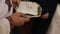 Close up of luxurious rings on plate in the church. Wedding ceremony