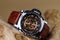 Close up of Luxury man wrist watches placed on timber in brown background