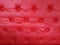 Close-up luxury red leather cushion. sofa retro. upholstery