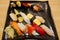 Close up of luxury sashimi sushi set on black plate in Otaru japanese restaurant