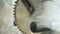 Close-up machine circular saw in wood in smoke. round blade detail. Malfunction or overheating of the tool