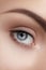 Close-up macro of beautiful female eye. Clean skin, fashion naturel make-up