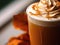 Close-up macro of a delicious pumpkin spice latte cappuccino coffee with whipped cream and caramel.