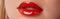 Close up macro female plump lips with red gloss. Beauty fashion portrait personal care and make up