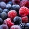 Close-Up Macro of Frozen Berries: Raspberries, Blueberries, and Blackberries.