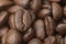 Close up macro a group roasted brown or black coffee grains background