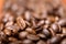 Close up macro a group roasted brown or black coffee grains background. Close up coffee beans