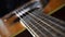 Close up macro on guitar with focus shift on strings or chords. Musical instrument. Music and sound concept