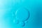 Close-up macro oil bubbles. Blue abstract scientific backdrop. Concept laboratory test
