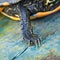 Close up macro over an aquatic turtle foreleg with black scales and yellow lines, hudge claws