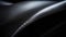 Close-up macro photo of dark, cool carbon fiber material on a red sports car\\\'s curves..