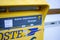 Close-up macro shot of French La Poste postbox for the public with schedule