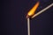 Close up Macro shot of a ignition match on a second match captured in super slow motion