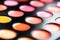 Close-up macro shot of lipgloss palette. Colourful salon cosmetics for makeup artist. Vibrant make-up product. Soft focus