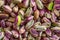 Close-up macro shot of roasted and shelled Australian pistachio nuts.