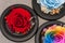 Close up macro shot of three articial roses.