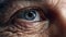 Close-up macro view on the blue eye of senior man