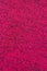 Close-up of a magenta fabric pattern, background