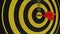 Close up of magnetic darts hitting a dartboard, bullseye