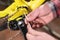 Close-up maintenance of a mountain bike. Male hands adjust the chain tension. Technical condition monitoring in the