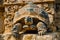 Close Up of a Majestic Tortoise in a Historical Setting with Intricate Stone Carvings in the Background