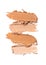 Close-up of make-up swatches. Smears of beige skincare beauty product concealer or foundation