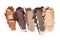 Close-up of make-up swatches. Smears of crushed gray, beige and brown eye shadow