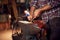 Close Up Of Male Blacksmith Making Wood Shavings With Knife For Kindling On Anvil To Light Forge