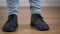 Close-up of male caucasian feet in elegant broggi shoes stomping on the floor. Adult man jumping down, turning and