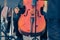 Close up of male cellist holding cello at an outdoor concert