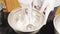 Close-up of male chef`s hands preparing delicious ice cream balls from berries and fruits