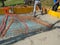 CLOSE UP: Male contractors are pouring a concrete slab on a sunny summer day.