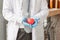 Close up of Male doctor with stethoscope and protect red heart in his hands, healthcare concept