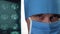 Close up male doctors eyes blinking. Doctor surgeon in medical mask and hat