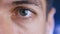 Close up of a male eye. Detail of a eye of a man looking at camera. Macro shot.