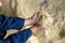 Close up of male farmer hands holding animal feed corn flour in farm storage area