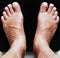 Close up of male feet on black digital floor glass scales