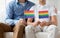 Close up of male gay couple holding rainbow flags