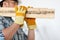 Close up of male in gloves carrying wooden boards