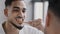 Close-up male guy reflection in the mirror bearded man brushing teeth with white whitening paste with wooden toothbrush