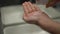 Close-up male hand with shaving cream pouring in slow motion. Unrecognizable Caucasian young man in bathroom at home in