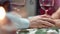 Close up male hand touching female arm feeling love at romantic dinner date. 4k Dragon RED camera