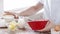 Close up of male hand whisking something in a bowl