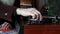 Close-up of male hands changing records in the turntable, retro turntable playing in home library, selective focus
