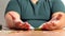 Close-up of male hands counting a stack of hundred-dollar us banknotes. A businessman is counting cash. The concept of