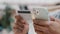 Close-up male hands holding mobile phone and bank card shopping online ecommerce. Unrecognizable african american man