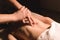 Close-up of male hands. Masseur does massage for the waist of a young girl. Rehabilitation, beauty therapy medicine